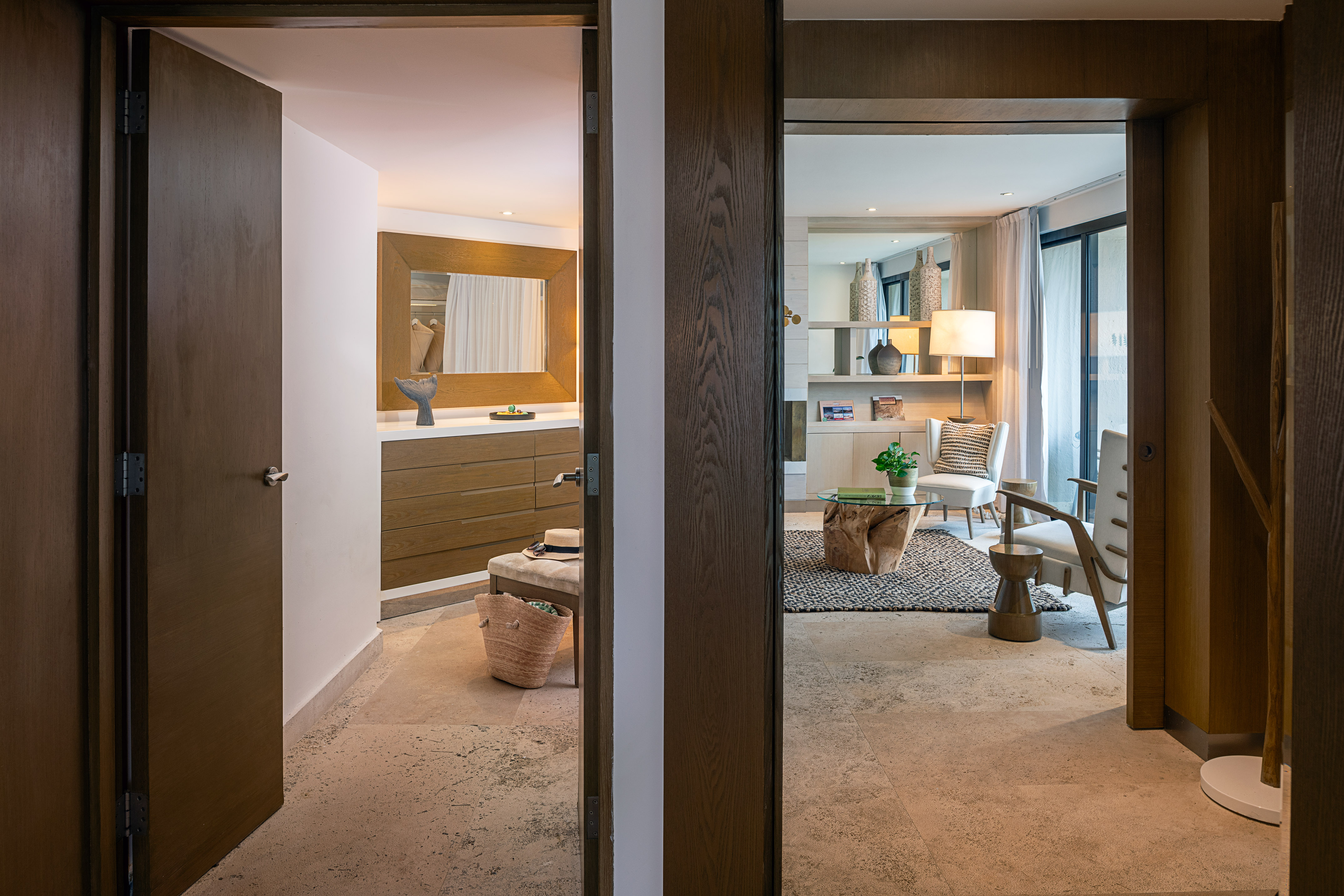Stylish walk-in closet and modern living room interior.