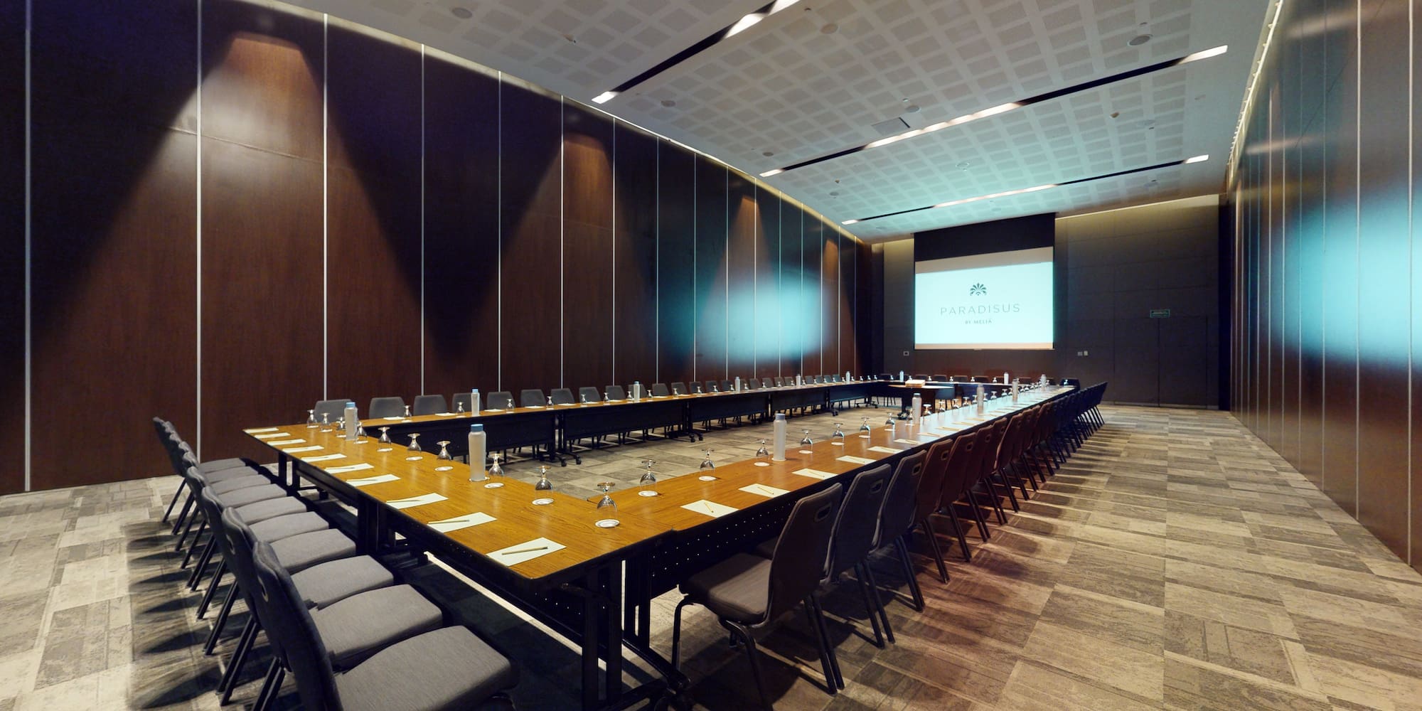 a long conference room with a large table and chairs