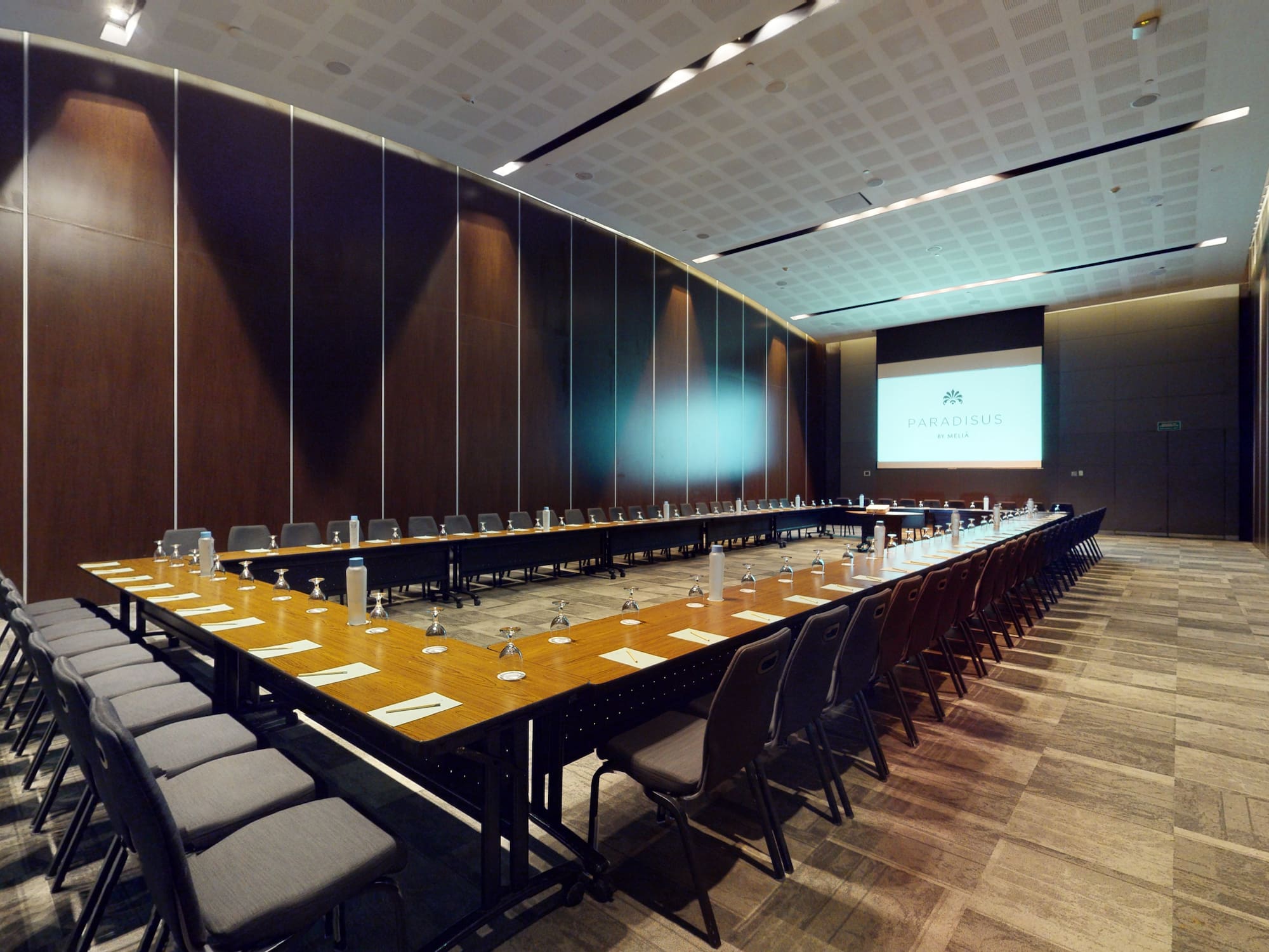 a long conference room with a large table and chairs