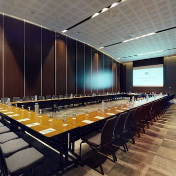 a long conference room with a large table and chairs