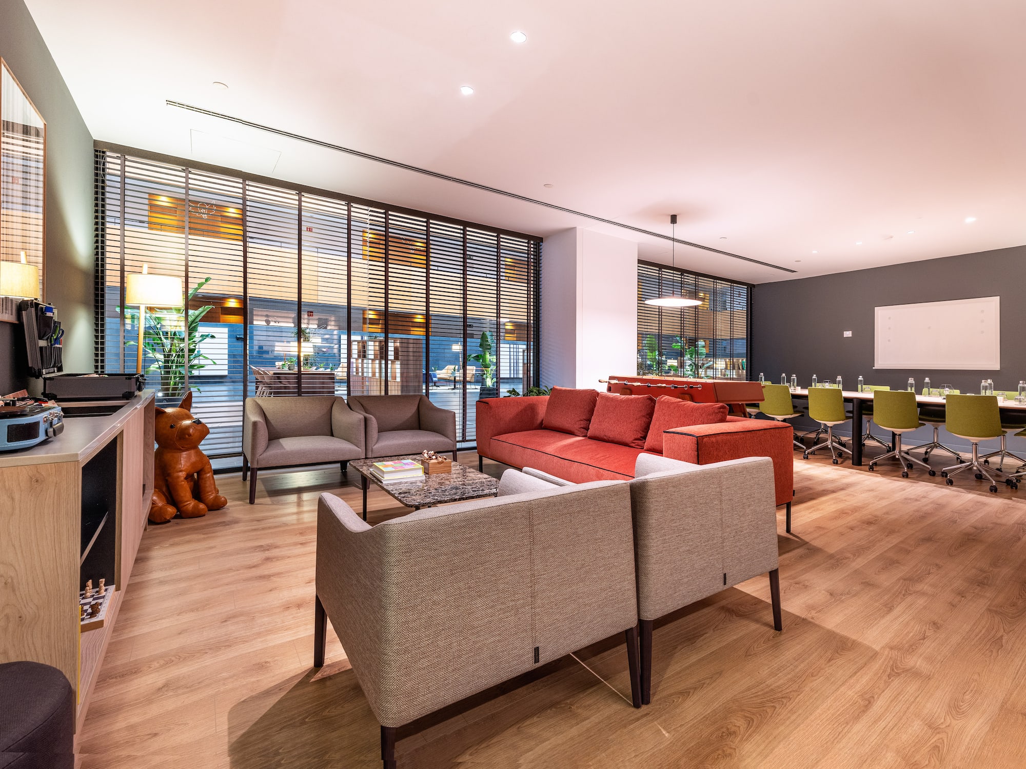 a room with a couch and chairs.