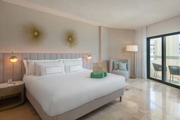 a room with a bed and a chair