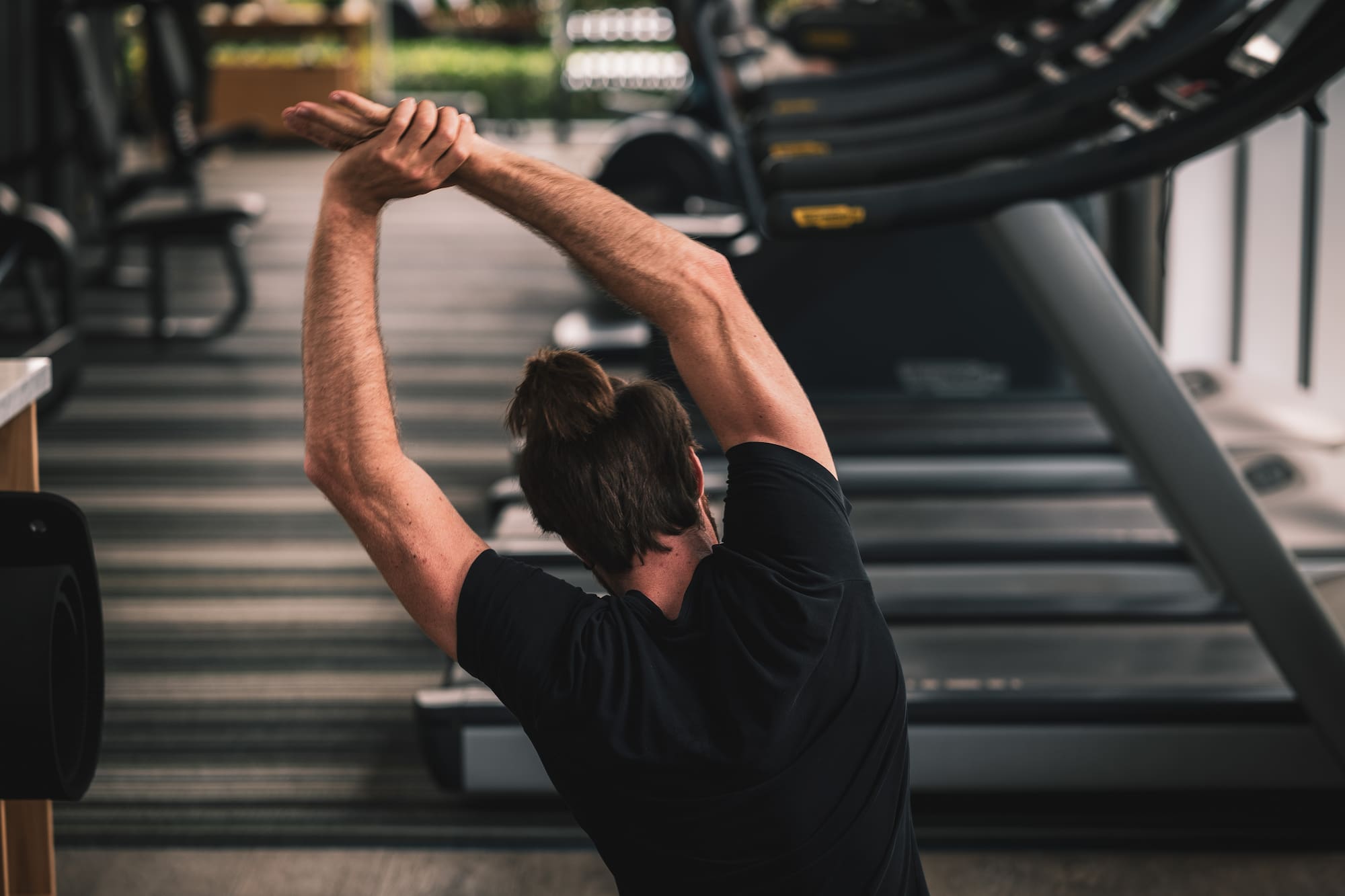 a man stretching his arms