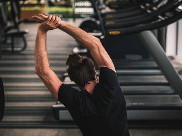 a man stretching his arms