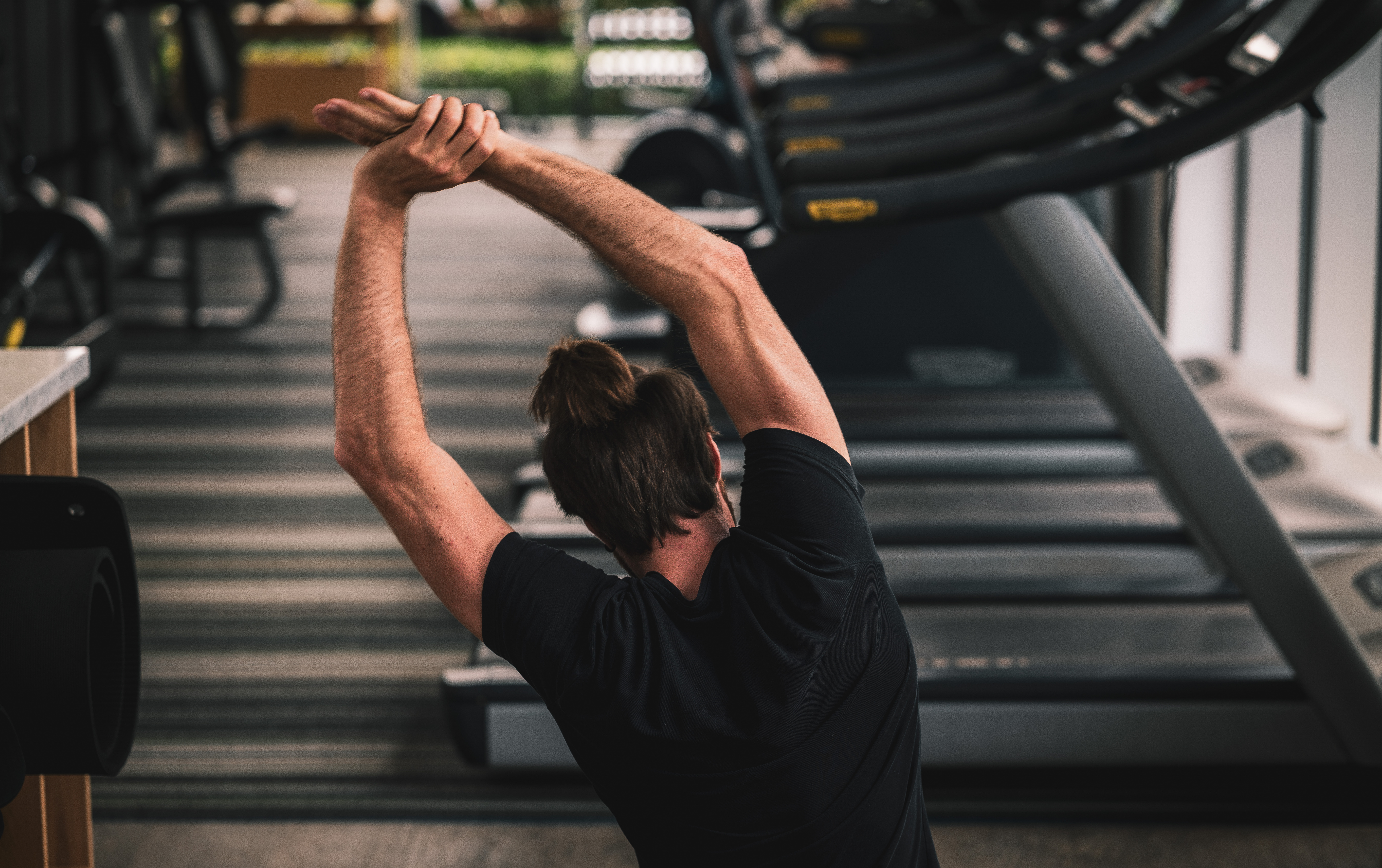a man stretching his arms