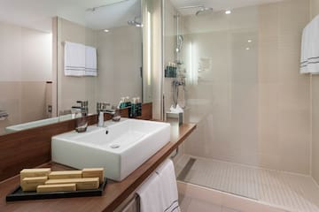 a bathroom with a shower and sink