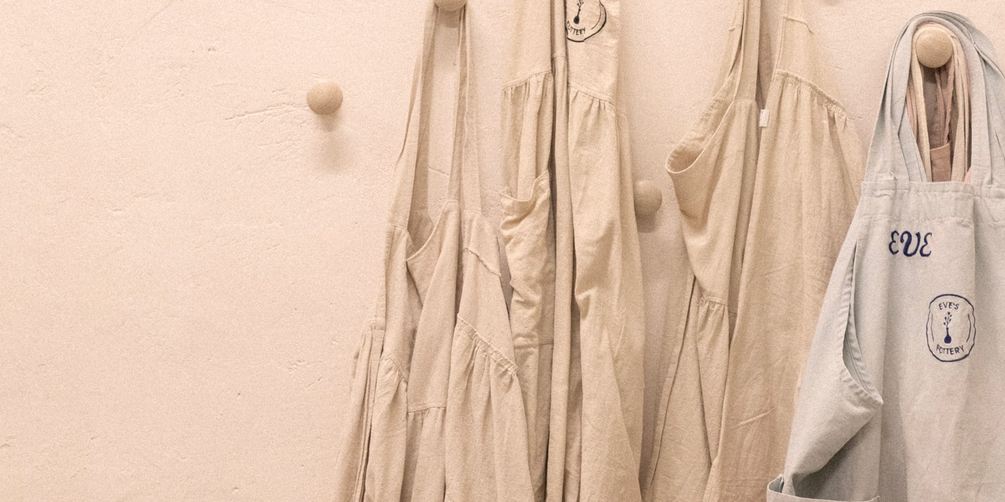 a group of aprons and bags