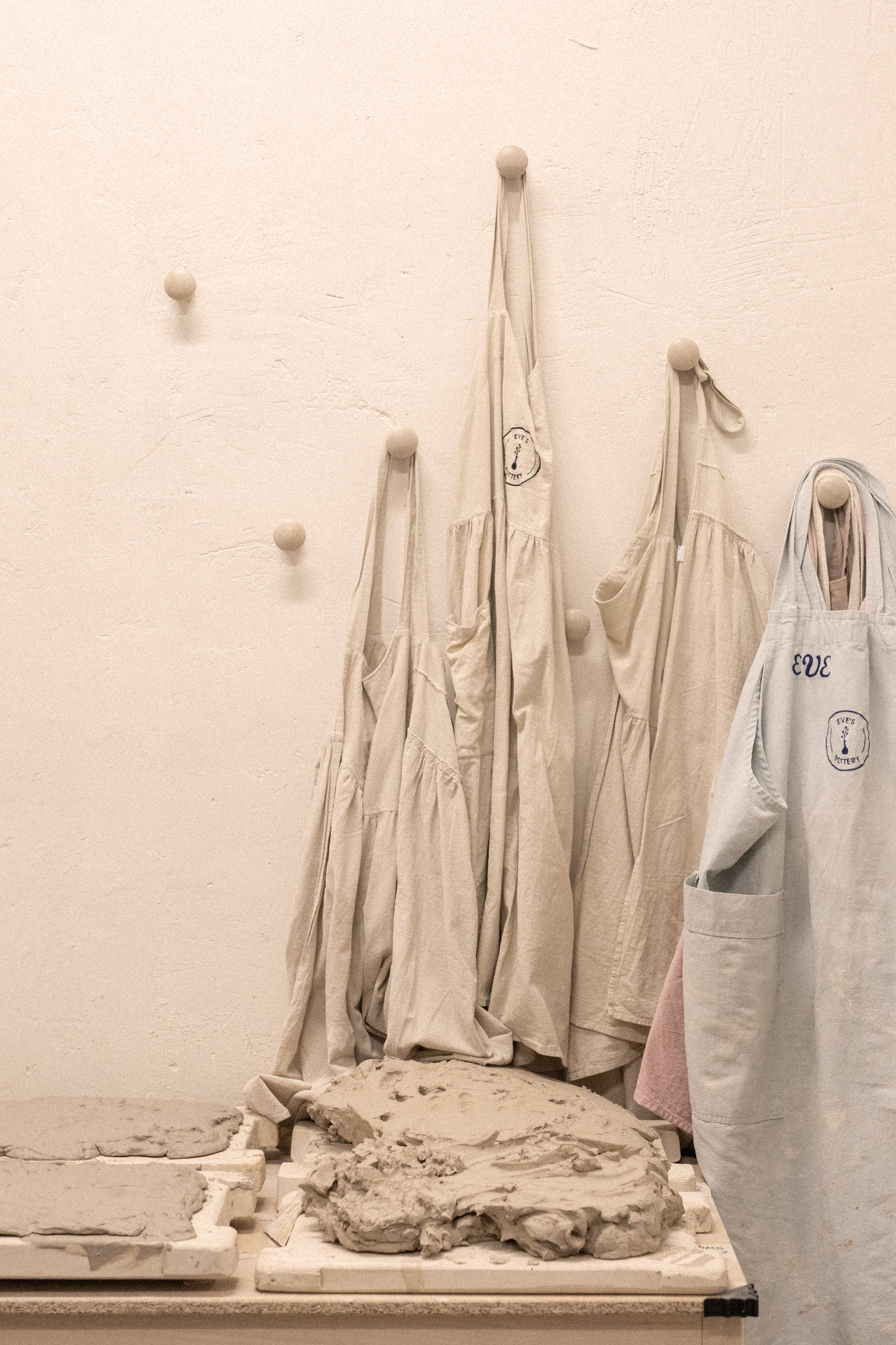 a group of aprons and bags