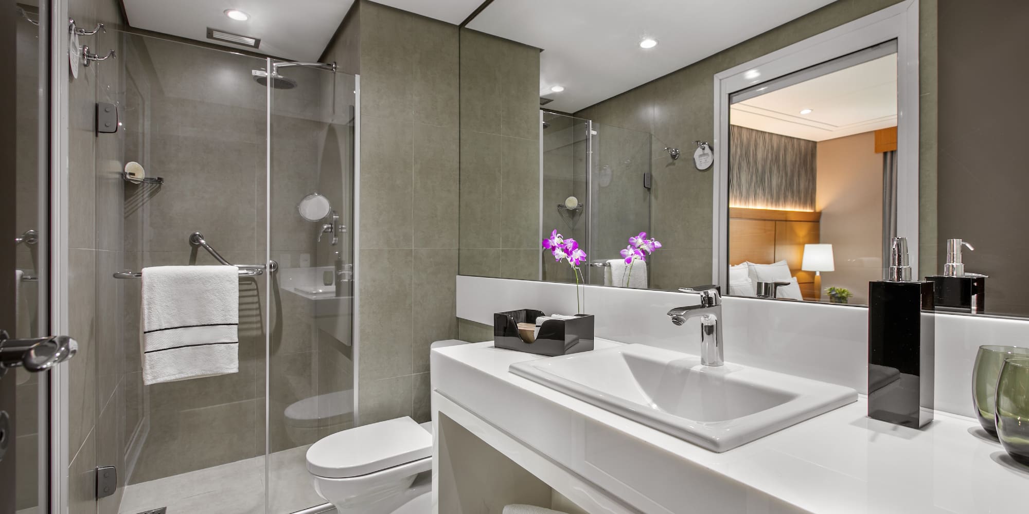 a bathroom with a sink and shower