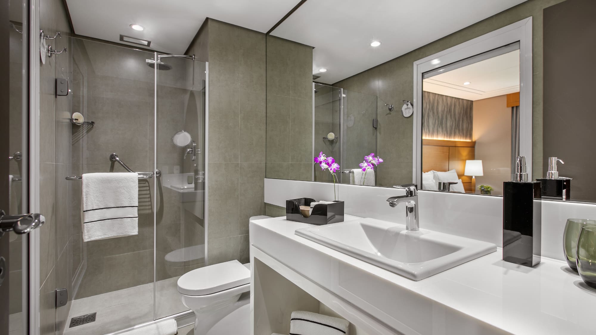 a bathroom with a sink and shower