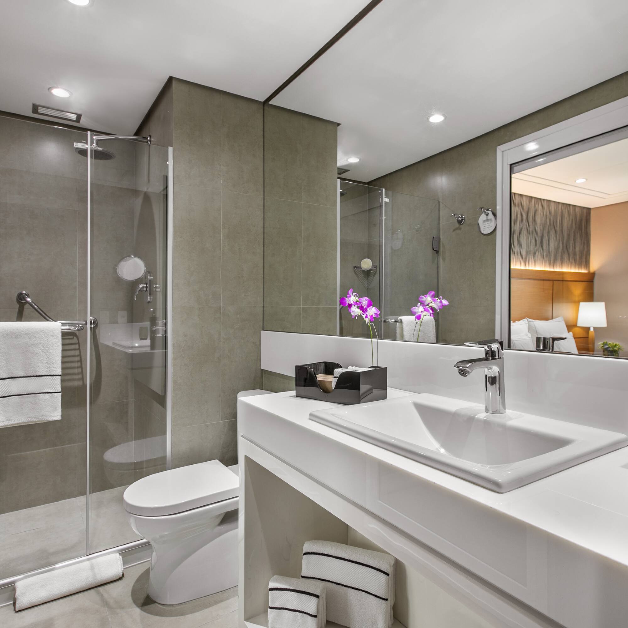 a bathroom with a sink and shower