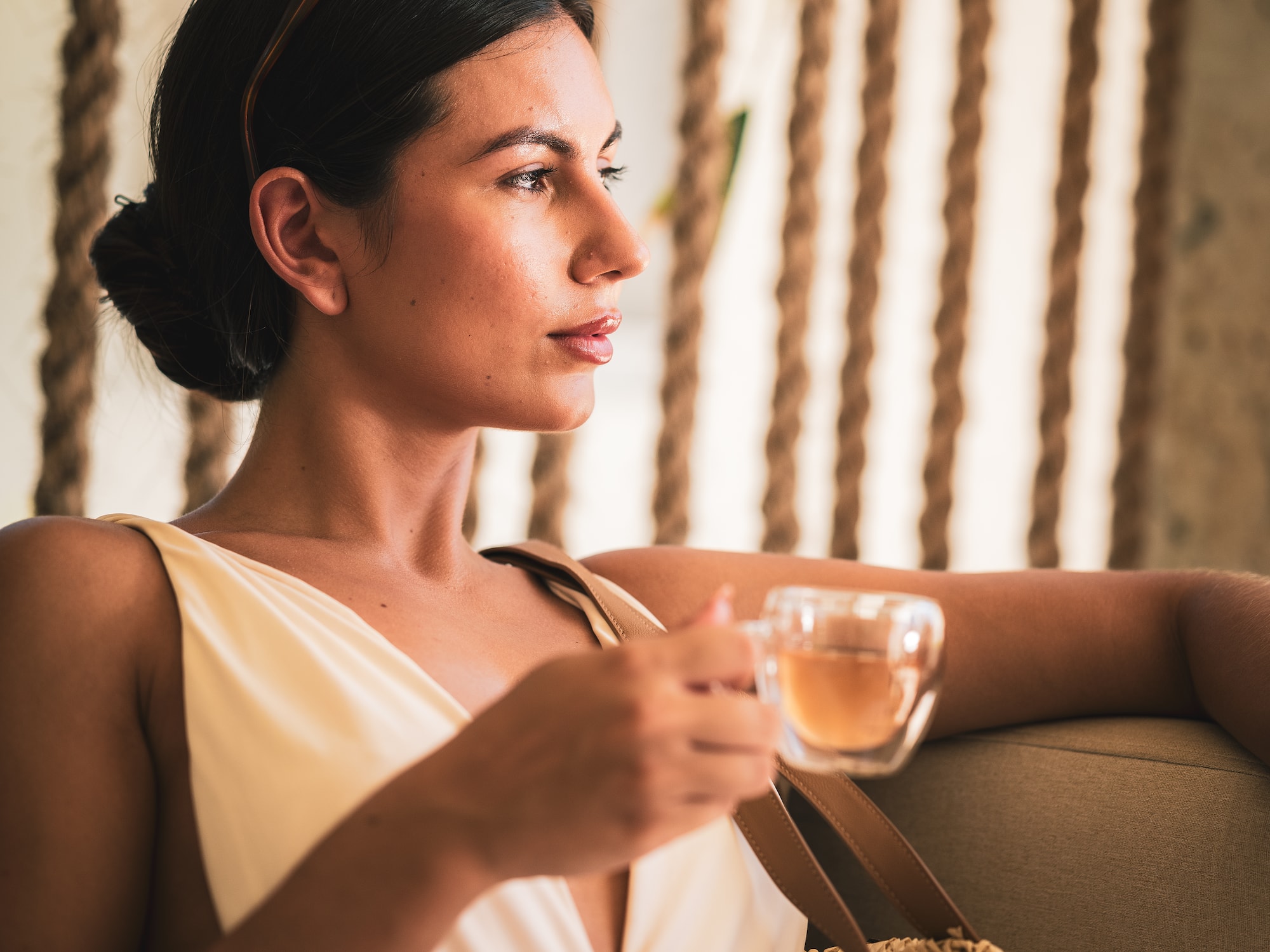 a woman holding a cup of tea