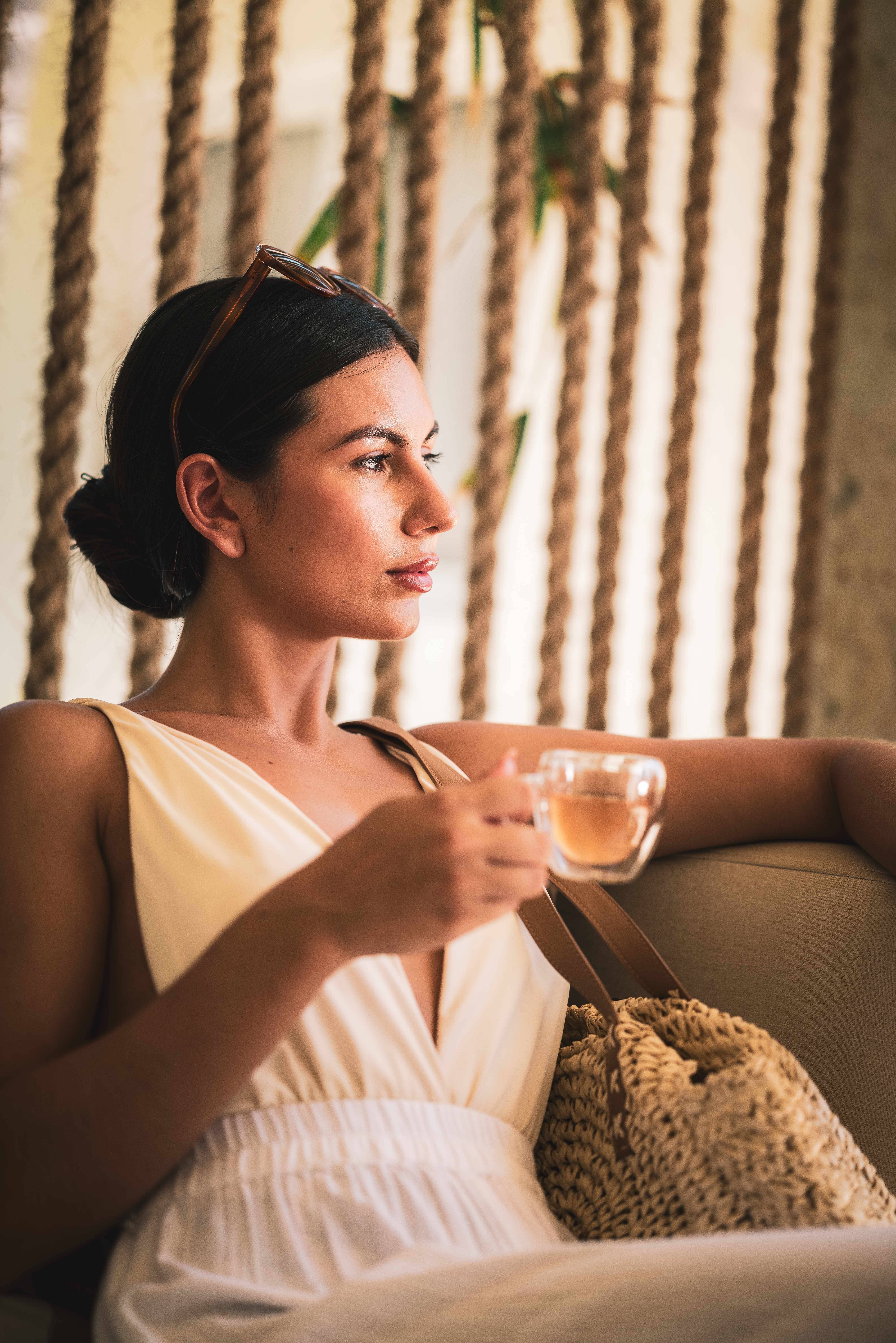 a woman holding a cup of tea