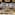 Hotel buffet with fresh fruit, yogurt parfaits, assorted cookies, and nuts.