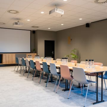 a room with a table and chairs