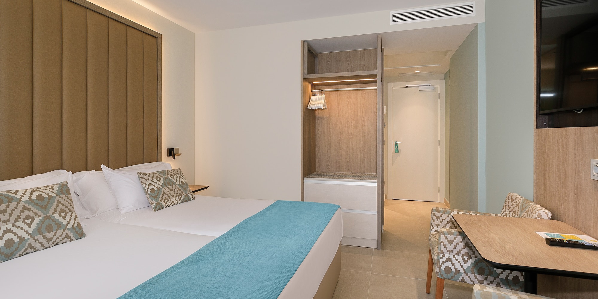 a room with a bed and a chair