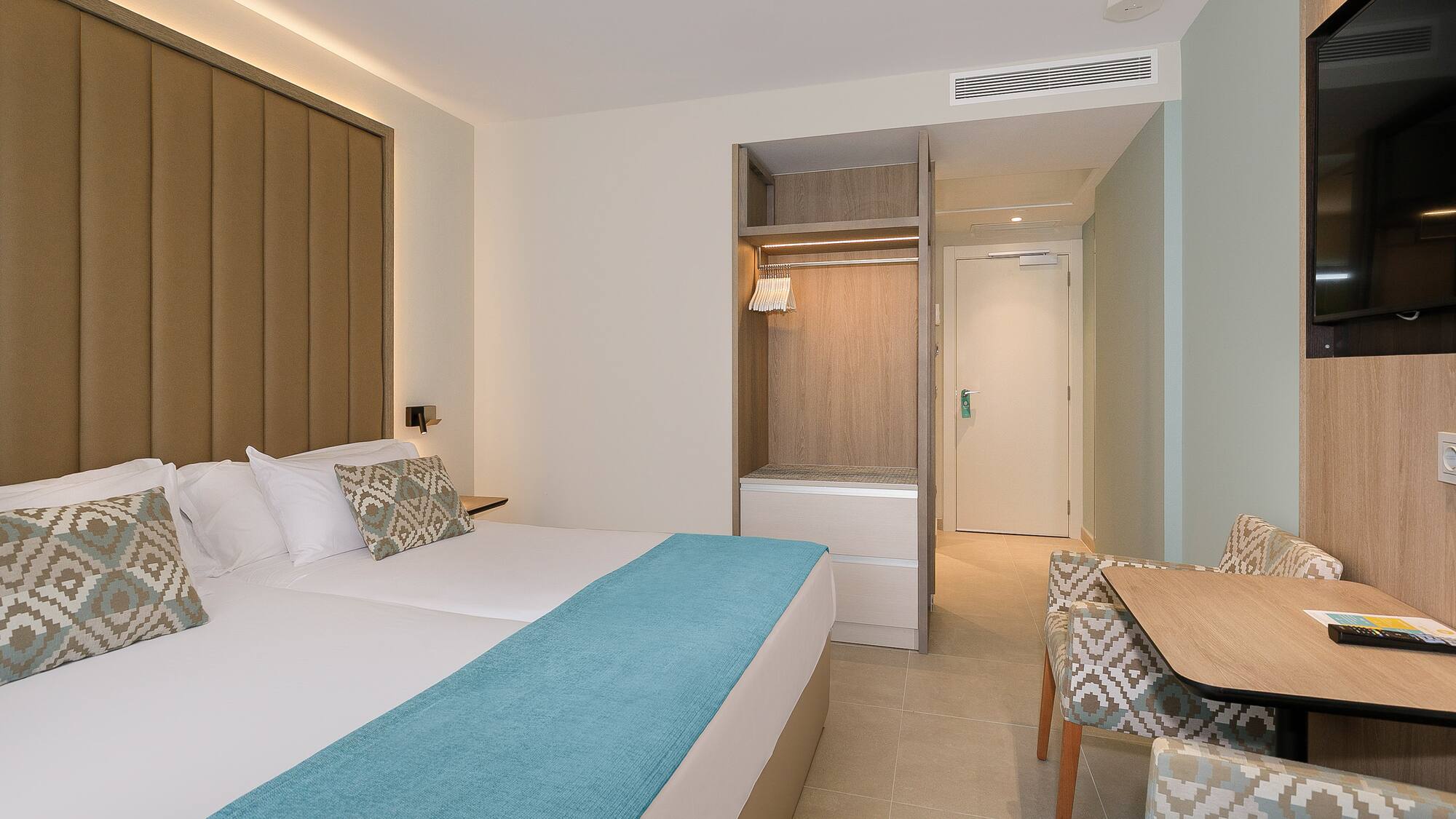 a room with a bed and a chair