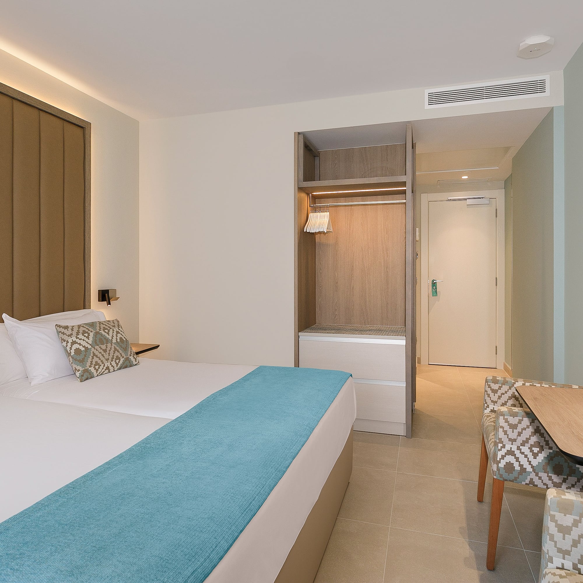 a room with a bed and a chair