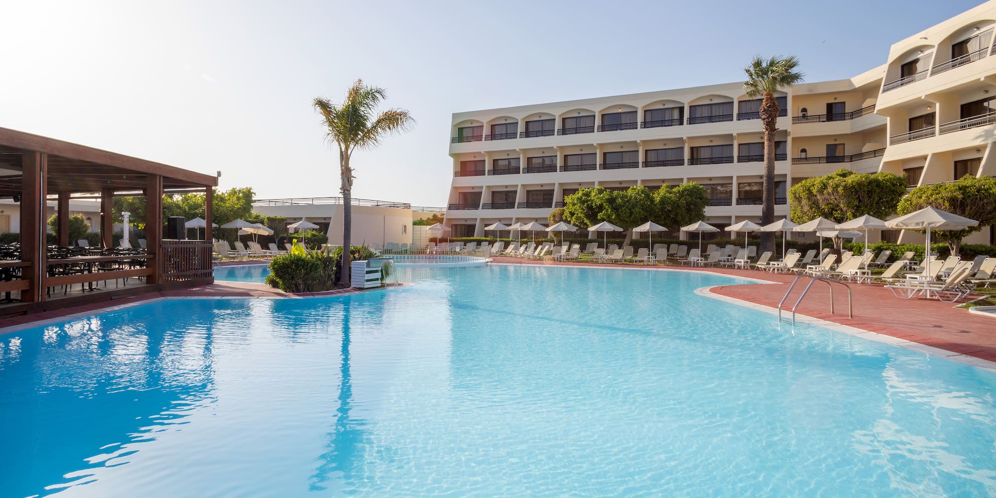 a swimming pool with a building in the background