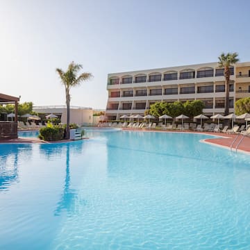 a swimming pool with a building in the background