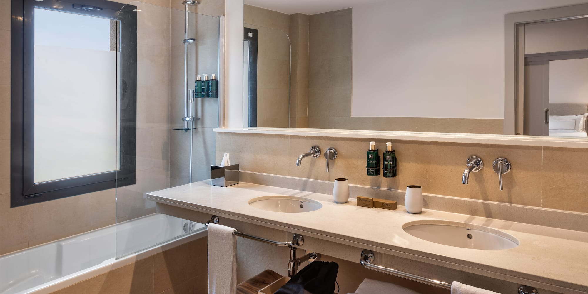 a bathroom with a shower and sink