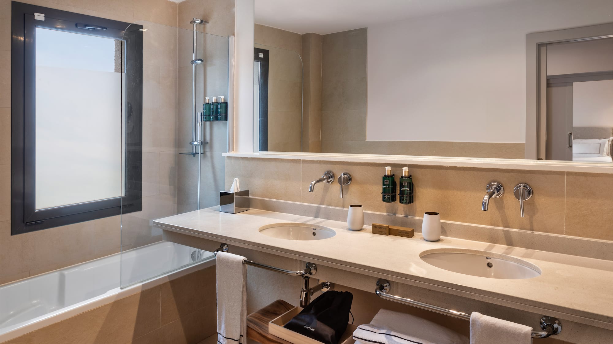 a bathroom with a shower and sink