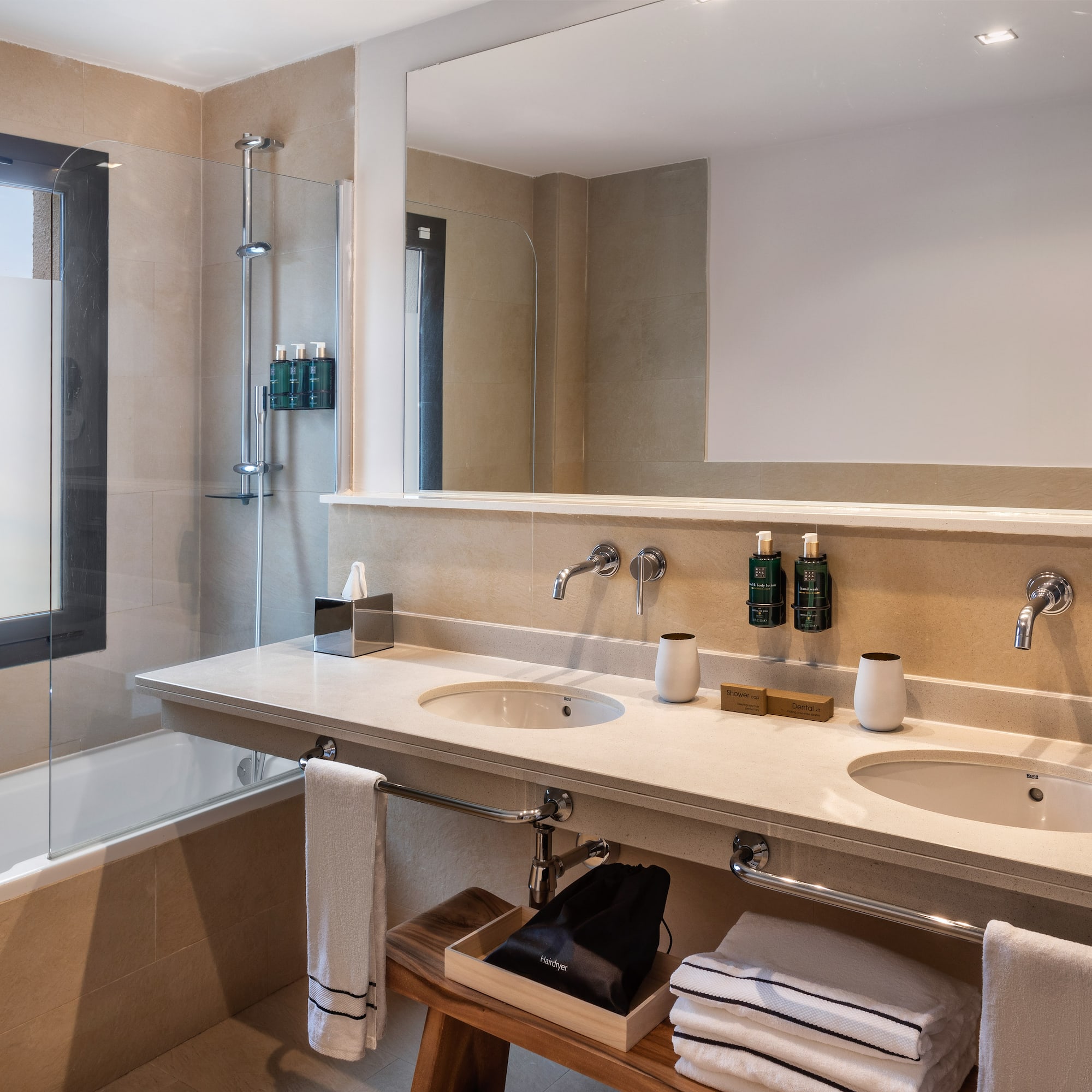 a bathroom with a shower and sink