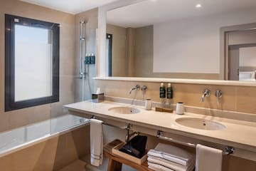 a bathroom with a shower and sink