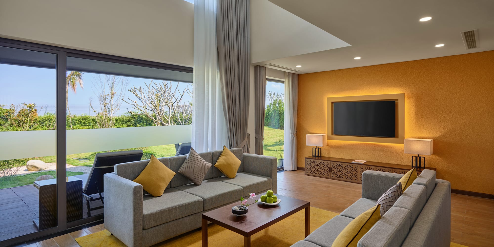 a living room with couches and a television