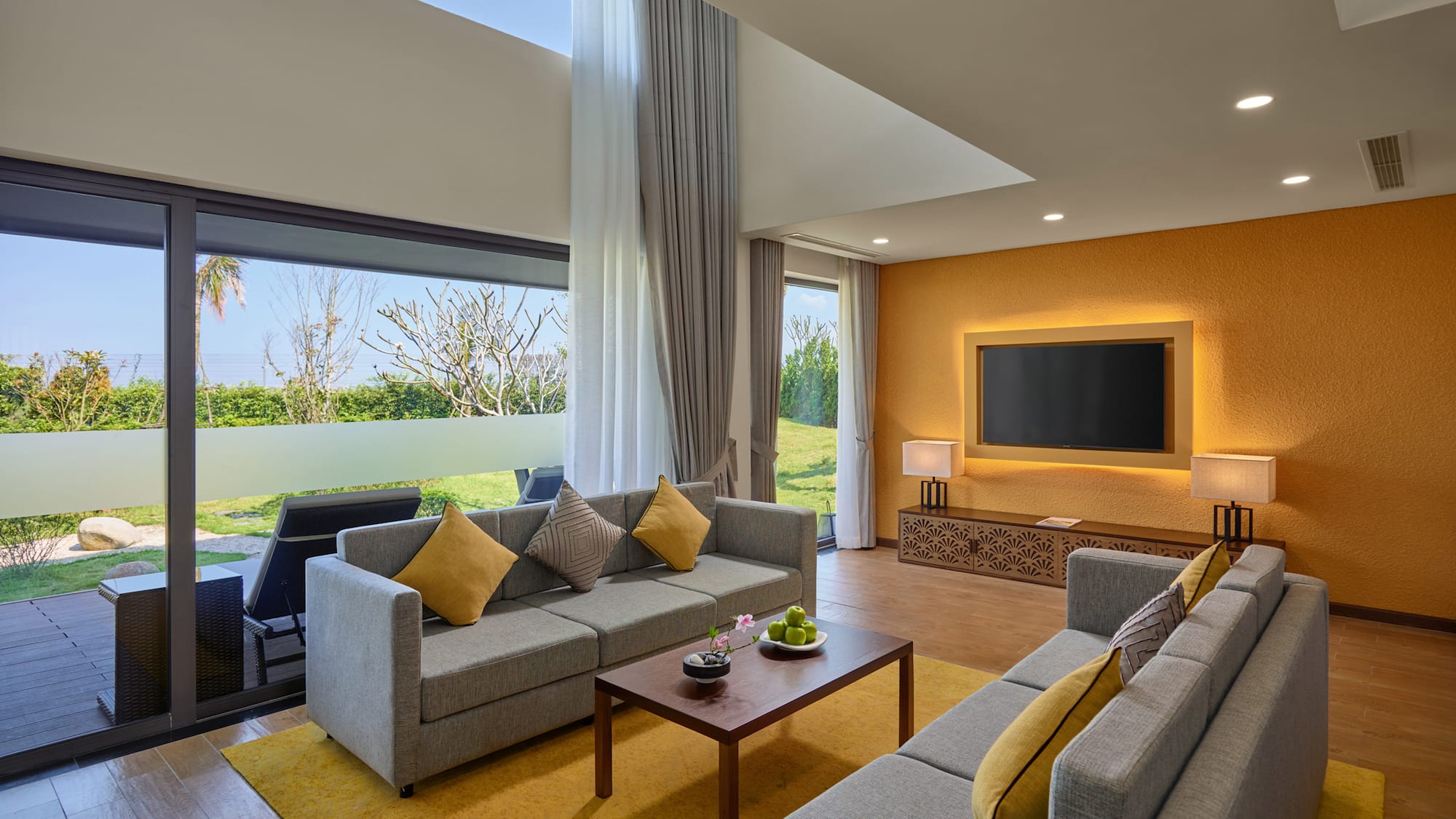 a living room with couches and a television