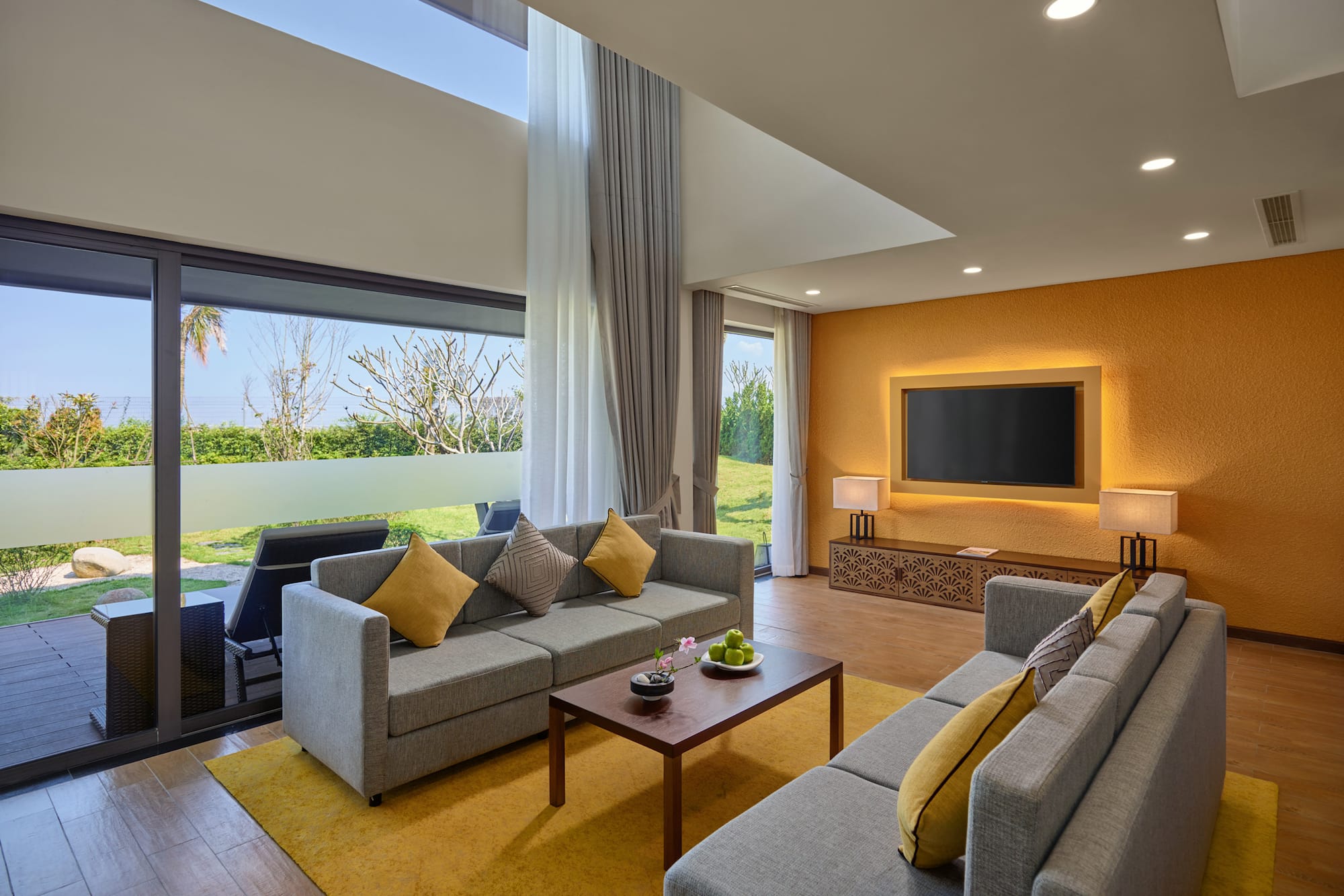 a living room with couches and a television