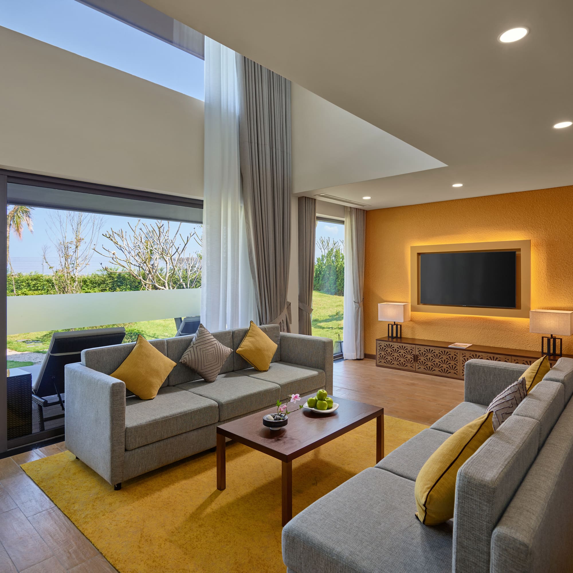 a living room with couches and a television