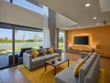 a living room with couches and a television