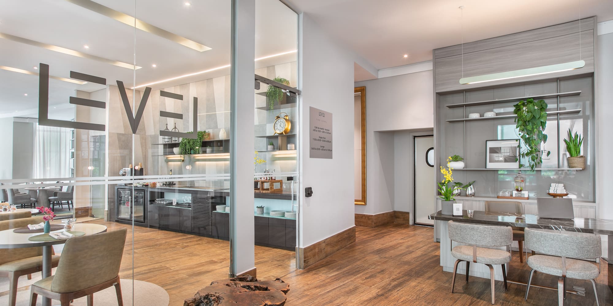 a room with a wood floor and a table and chairs