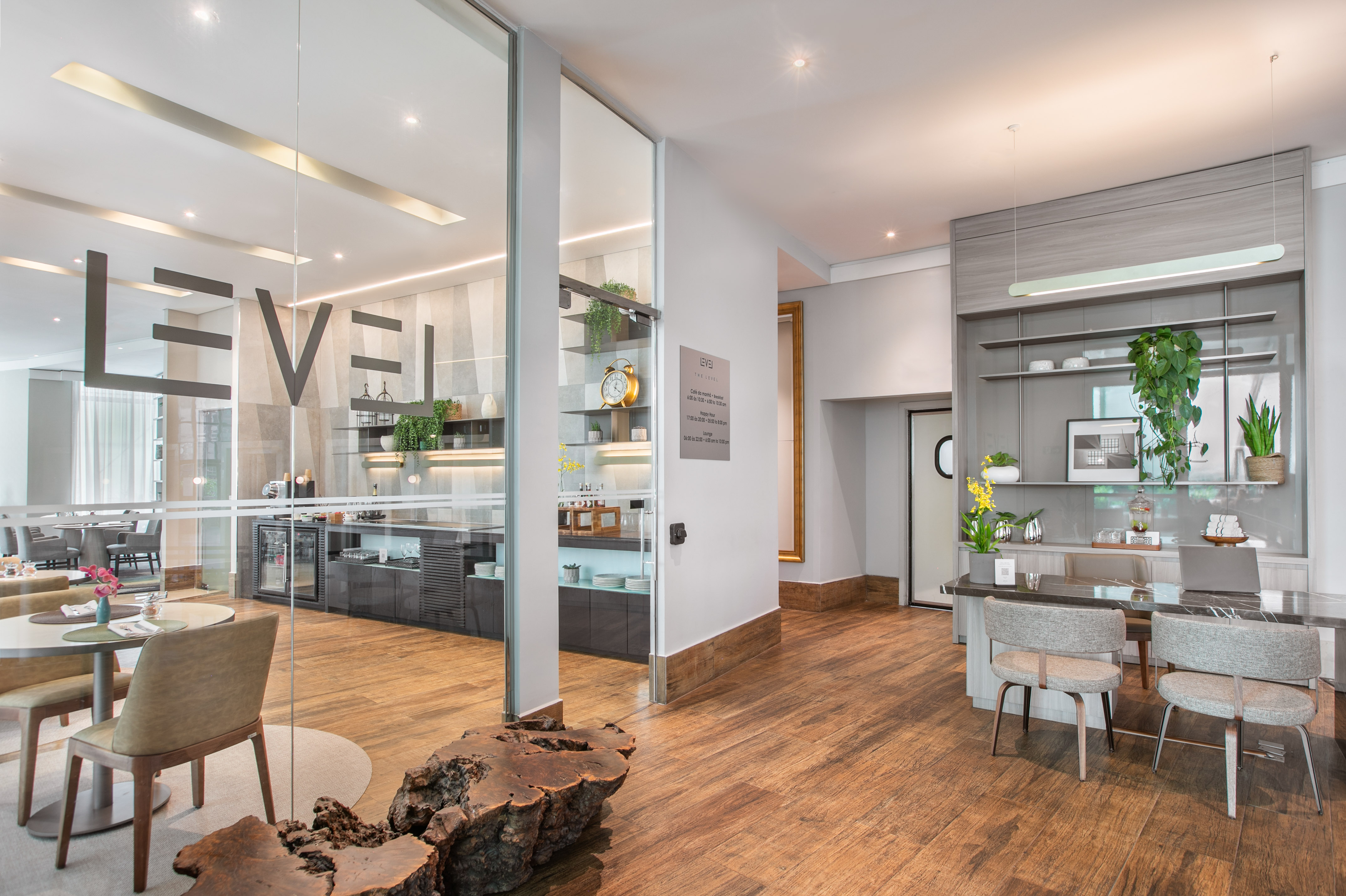 a room with a wood floor and a table and chairs