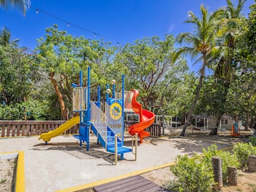 a playground with a slide and a slide