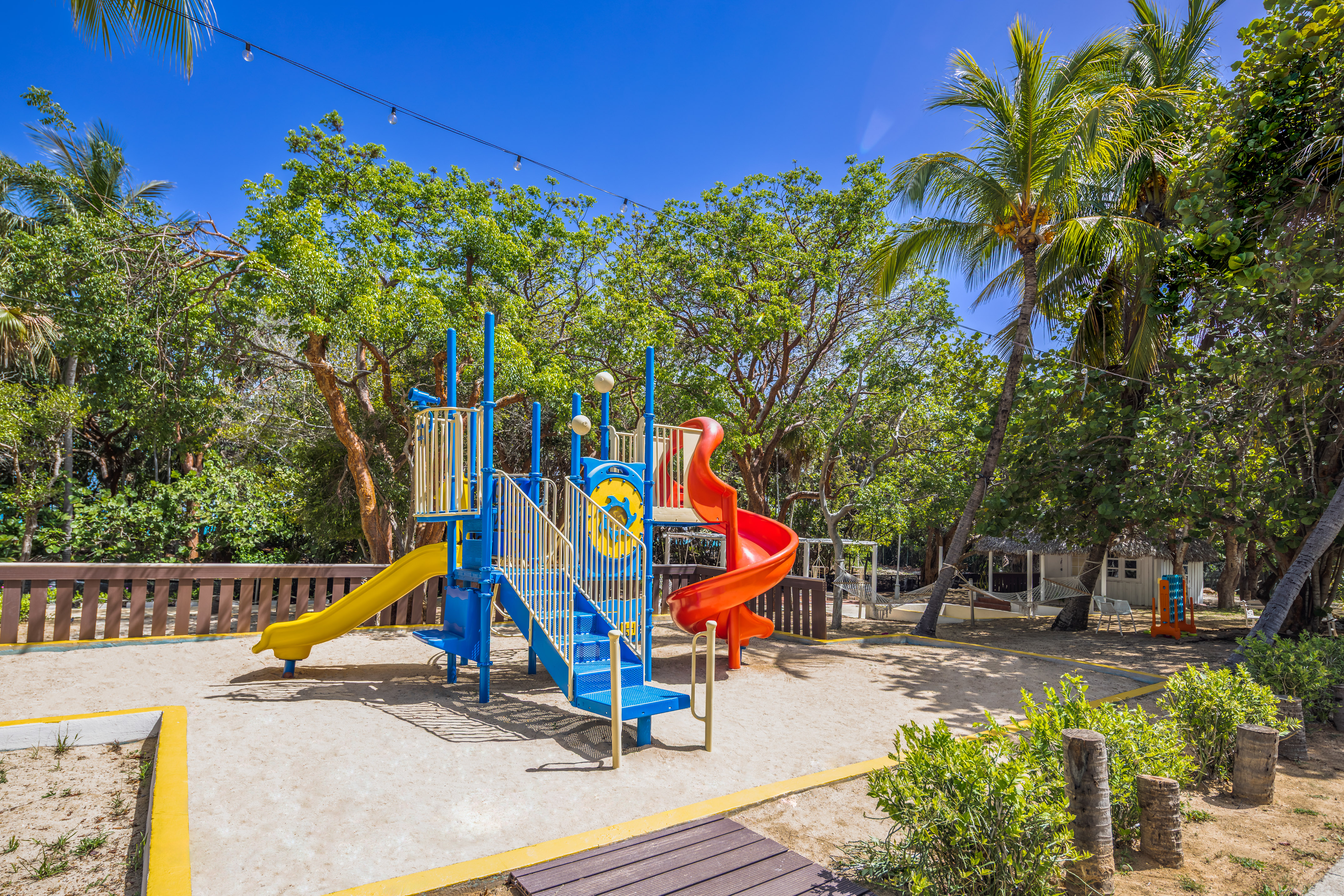 a playground with a slide and a slide