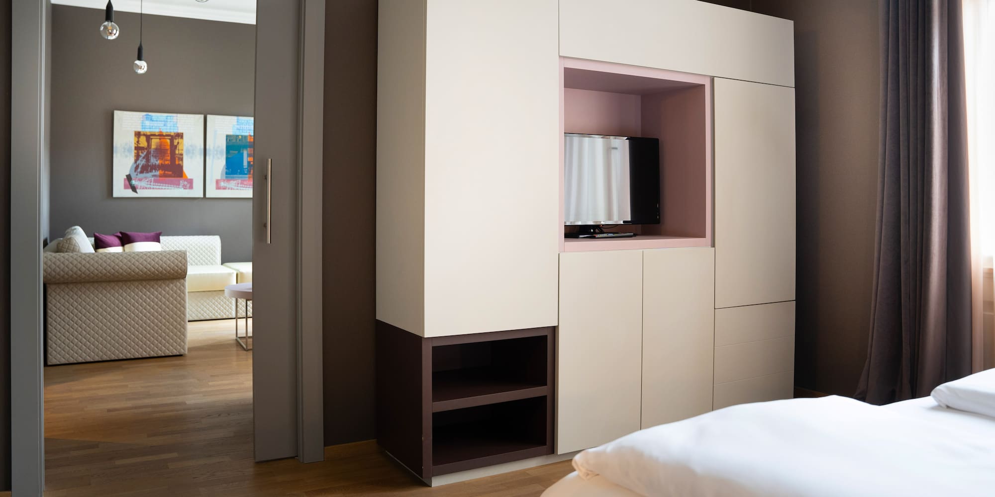 a room with a bed and a tv