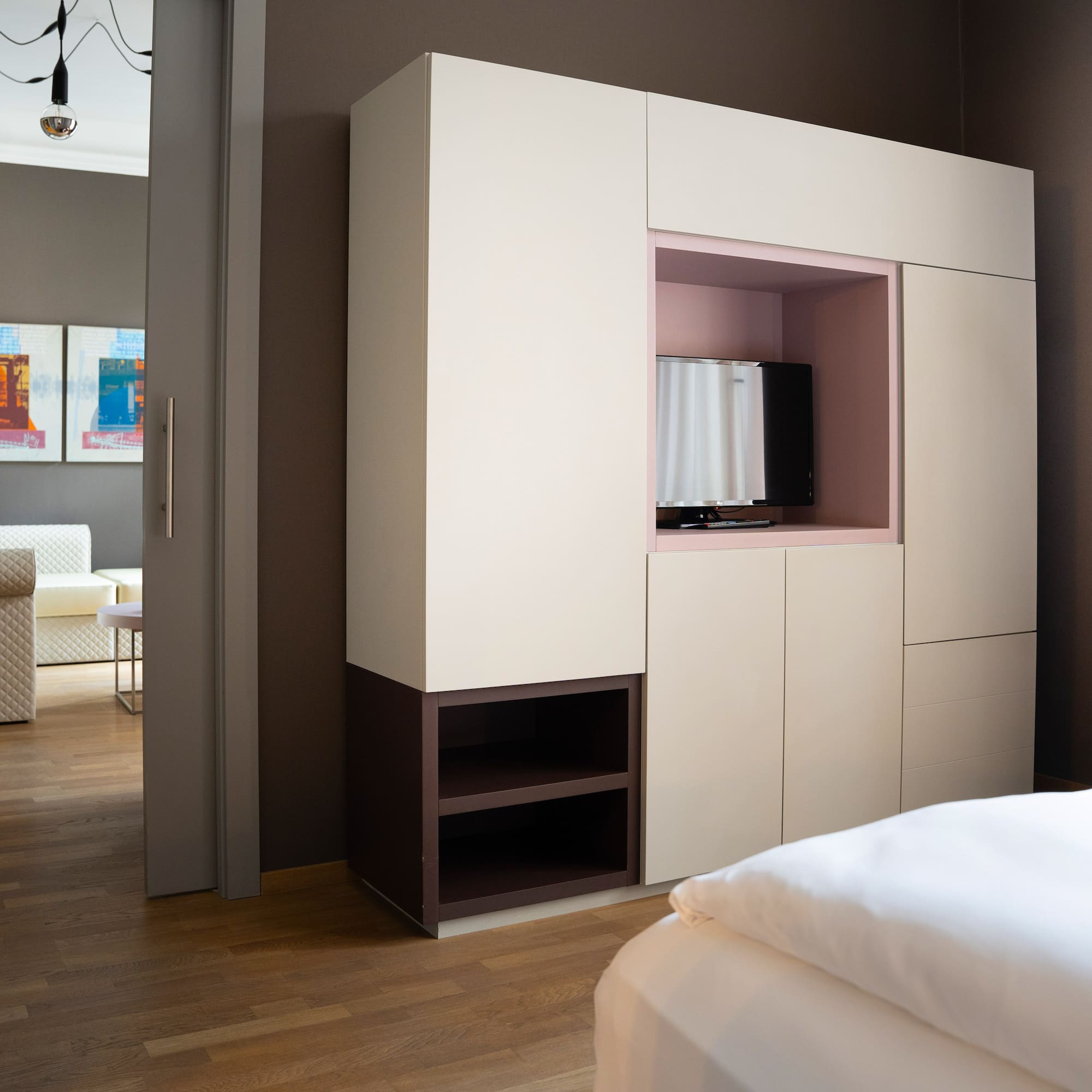 a room with a bed and a tv