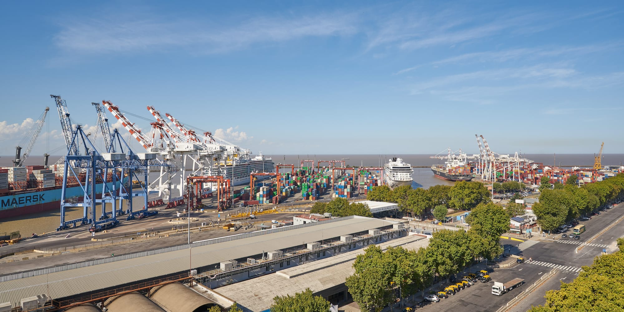 a large port with cranes and buildings