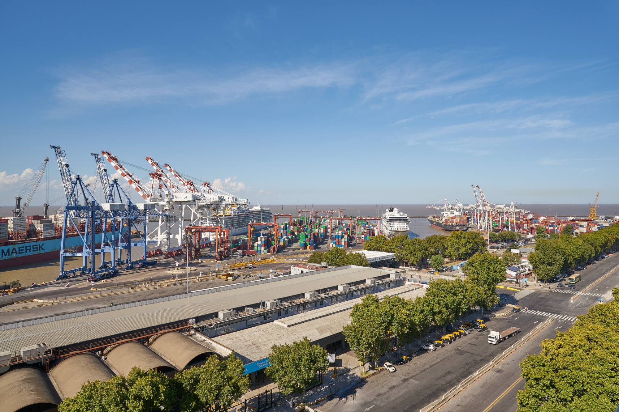 a large port with cranes and buildings