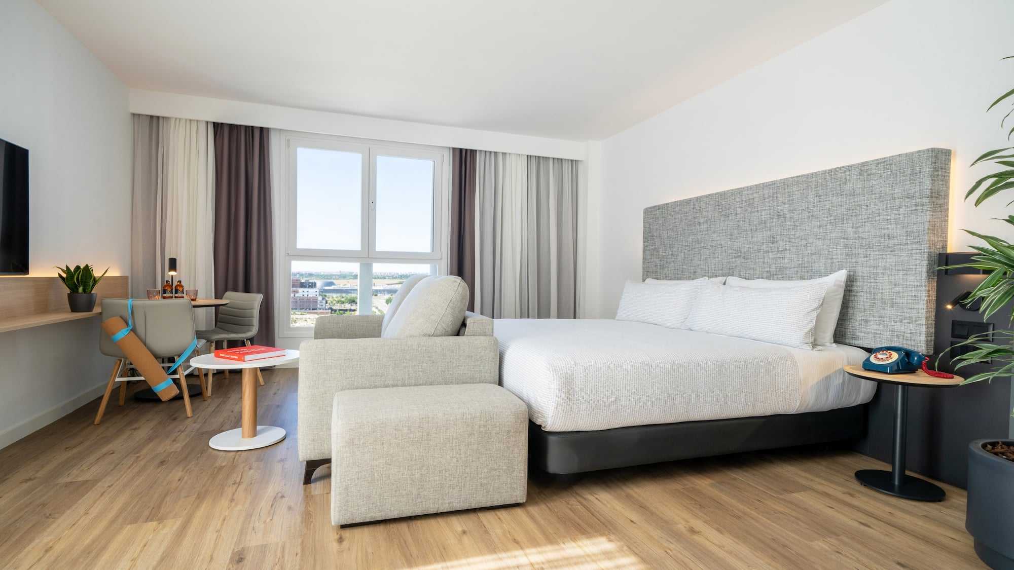 a bedroom with a bed and a chair