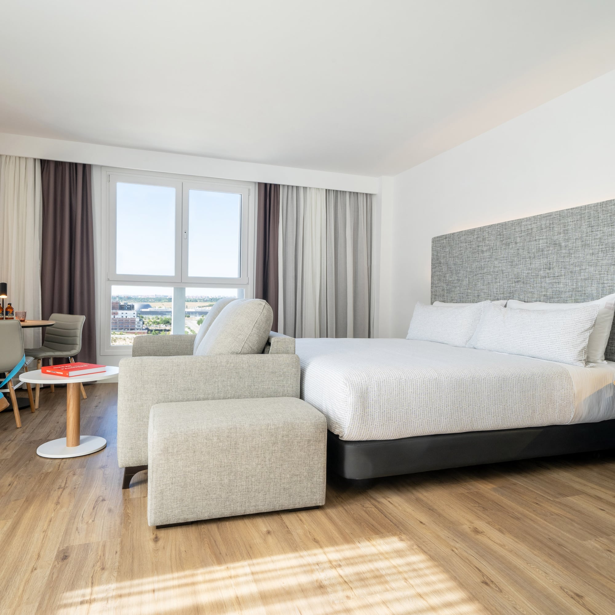 a bedroom with a bed and a chair