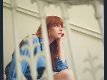 a woman sitting on a staircase