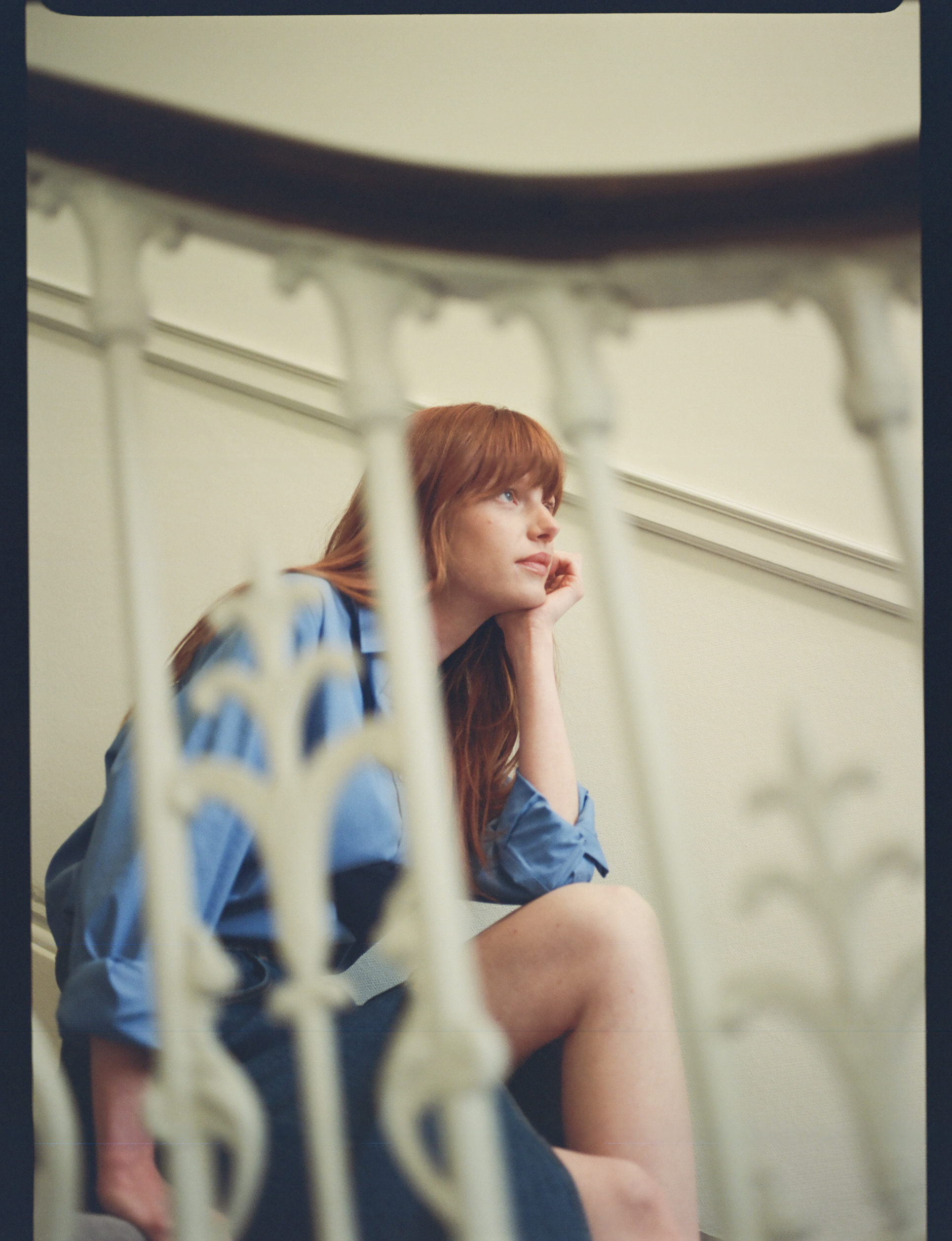 a woman sitting on a staircase