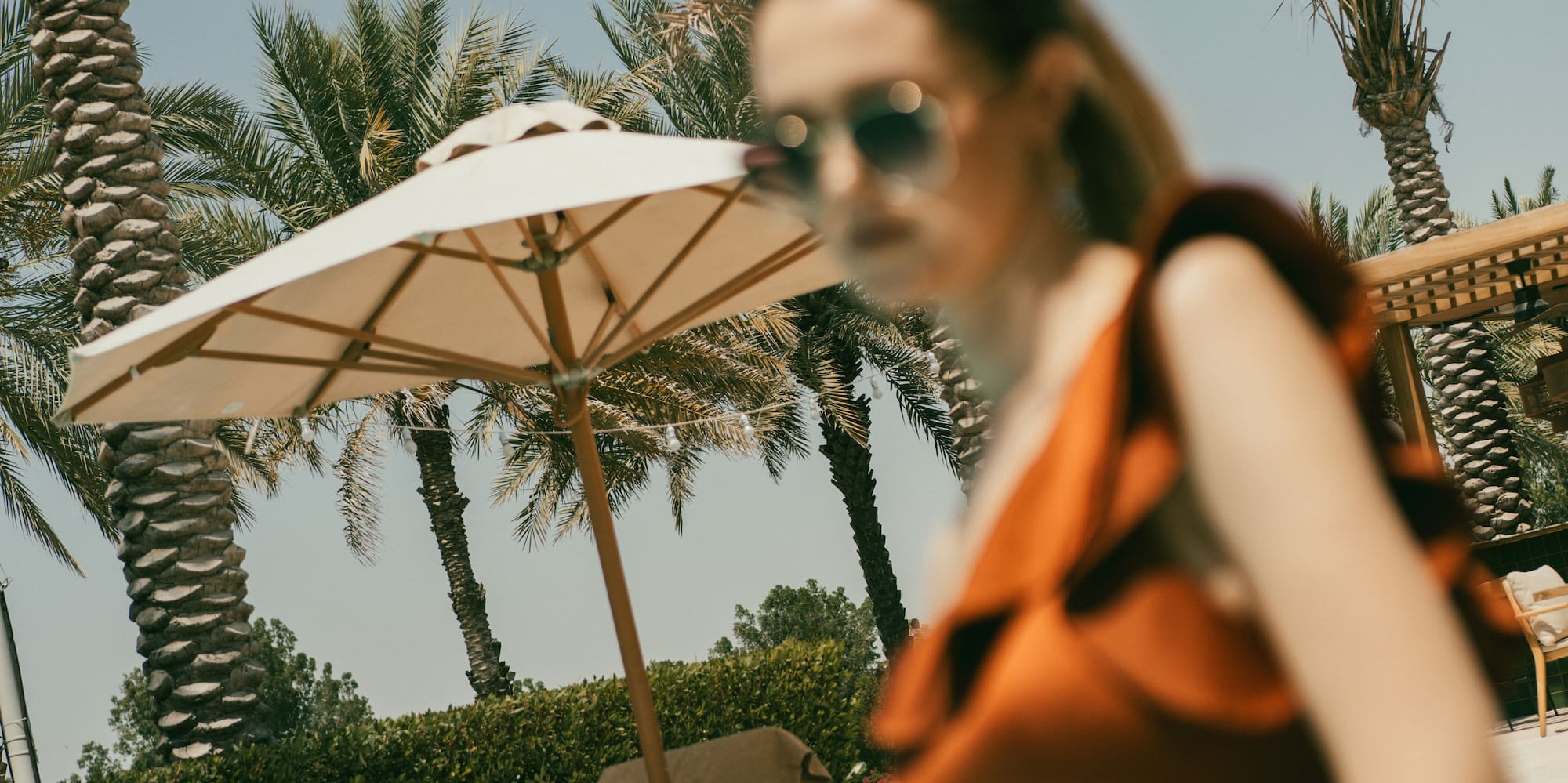 a woman in a swimsuit by a pool
