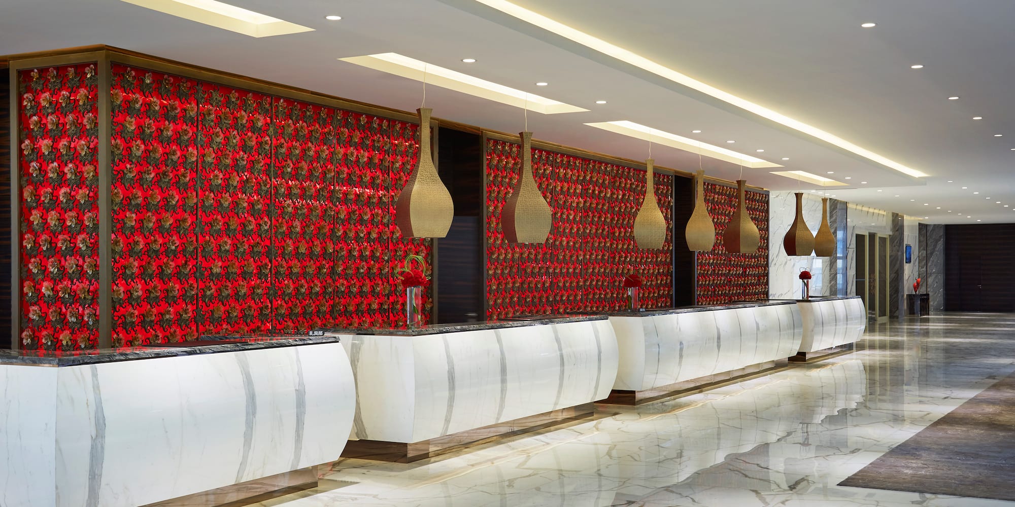 a reception area with red and white walls