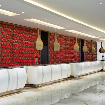 a reception area with red and white walls