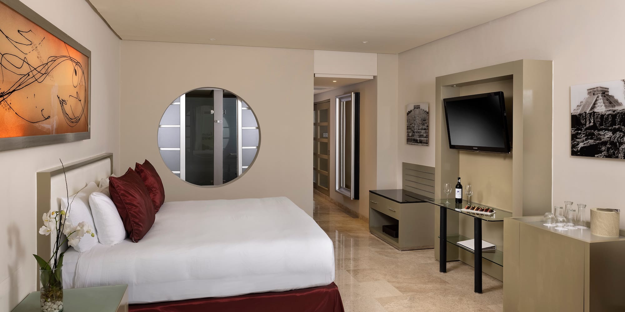 a bedroom with a television and a bed