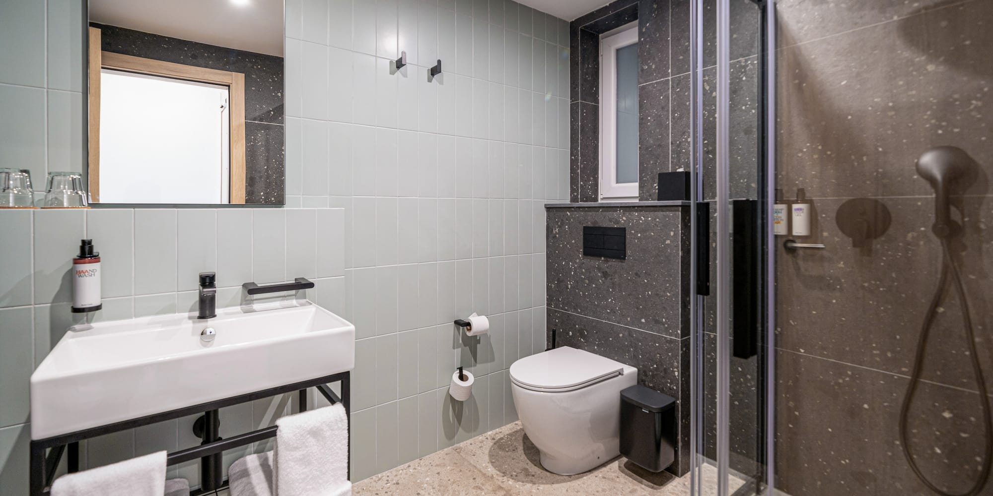 a bathroom with a shower and toilet